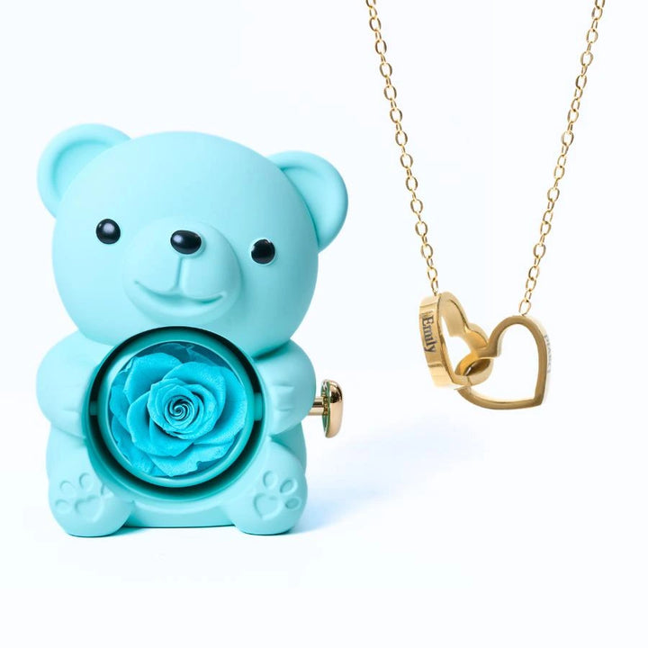 https://cdn.shopify.com/s/files/1/1025/8205/9347/files/Eternal_Rose_Bear_Intertwined_Necklace_-_Blue_Gold.jpg?v=1771017857