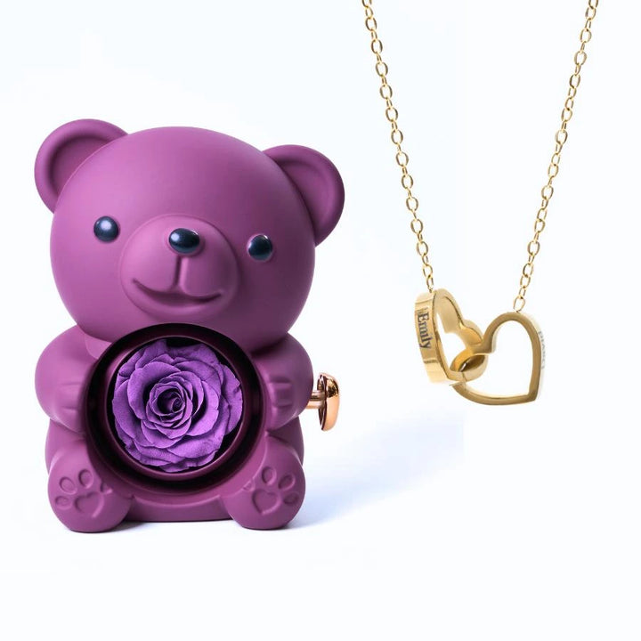 https://cdn.shopify.com/s/files/1/1025/8205/9347/files/Eternal_Rose_Bear_Intertwined_Necklace_-_Purple_Gold.jpg?v=1771017857